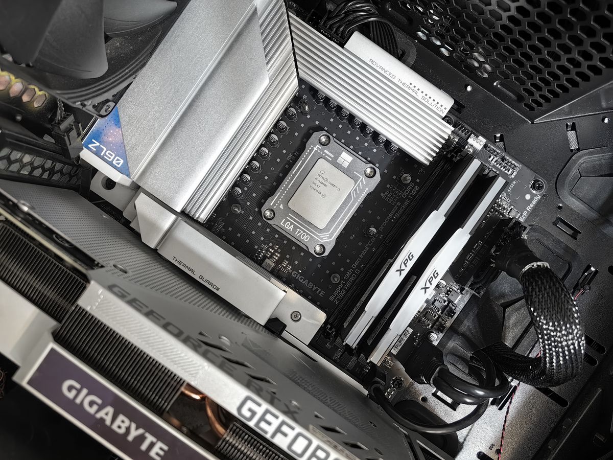 Open desktop PC build showing motherboard, RAM and components — tested used PC Singapore